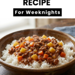 Close-up vertical shot of a bowlof savory Ground Beef Picadillo from a bowl of rice, with text at the top reading "Mexican Picadillo."
