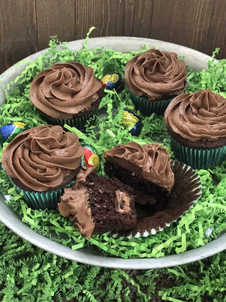 Are you looking for Easter cupcakes ideas? love Easter Desserts! So that's why I came up with this recipe for Cadbury Filled Chocolate Cupcakes With Chocolate Buttercream Icing. It's a yummy cupcake recipe that your kids will love to help you make.