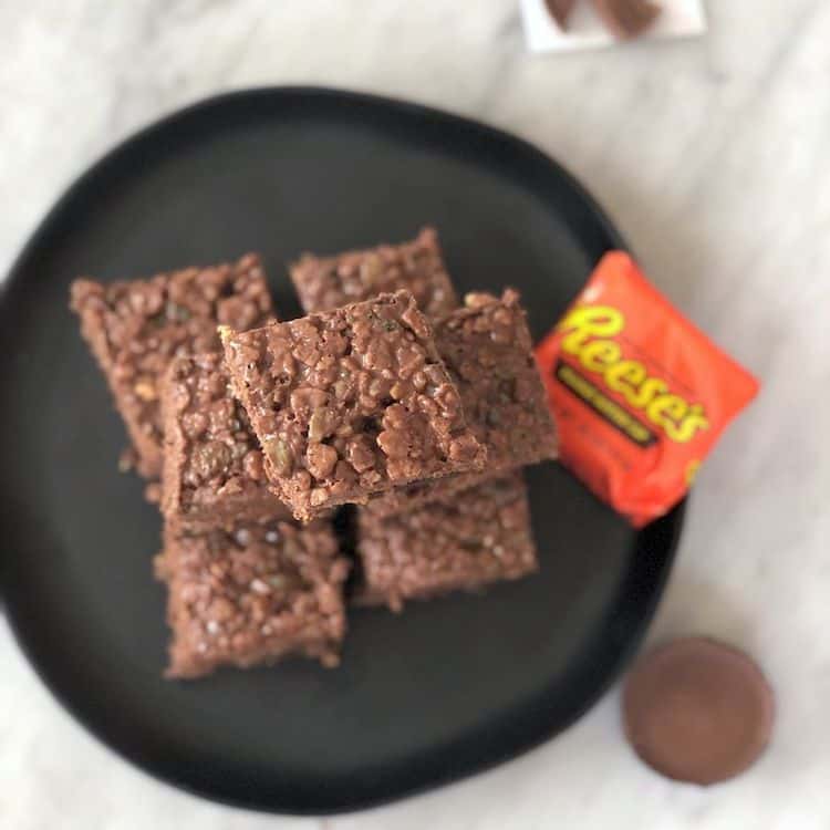 This is the Best Brownie Recipe! They are fudgy brownies made in a 9x13 pan topped with peanut butter cups, and a Rice Krispy mixture with more peanut butter & chocolate!