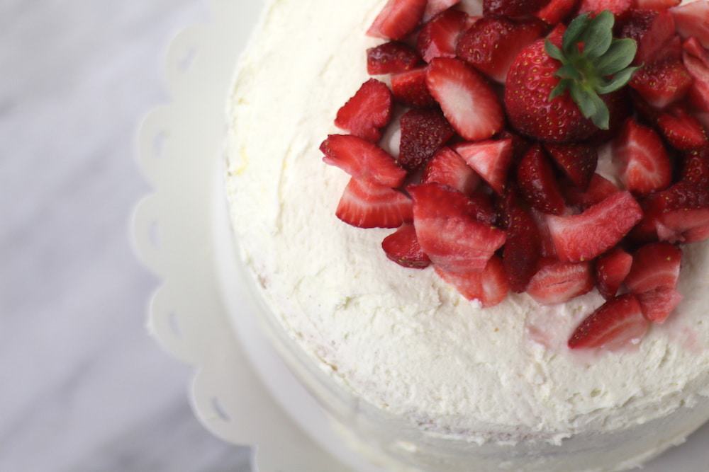 This strawberry vanilla cake is a delicious, layered dessert that combines the best of both worlds: the sweetness of strawberries and the creaminess of white chocolate. The vanilla cake layers are extra soft and are topped with a strawberry filling and white chocolate mousse. It’s the perfect cake for any occasion!