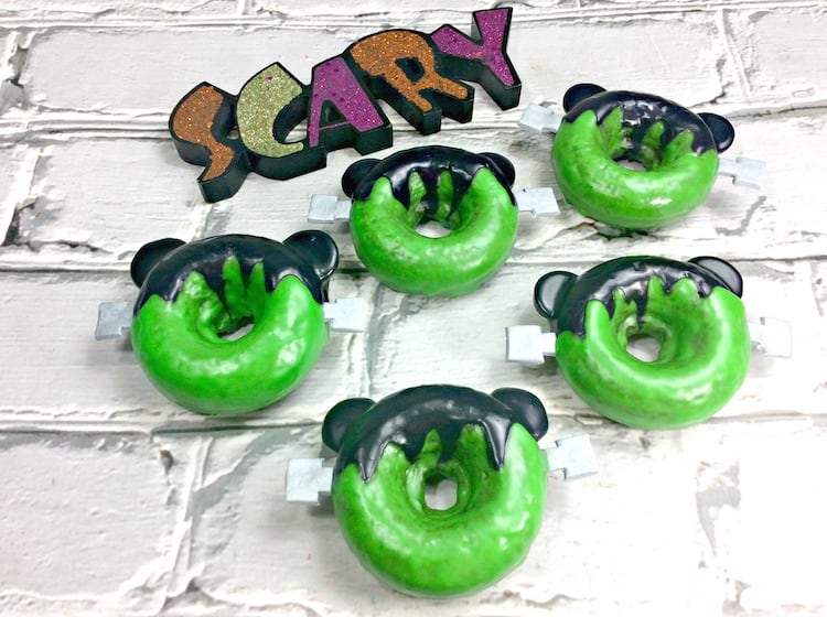 Mickey Frankenstein Doughnuts are great for a Halloween party! They are a yummy homemade chocolate baked doughnute with a glaze. 