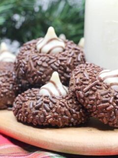 If you love peanut butter kiss cookies - you are going to love this Chocolate Kiss Cookies Recipe! It's the chocolate version of Peanut Butter Blossoms!