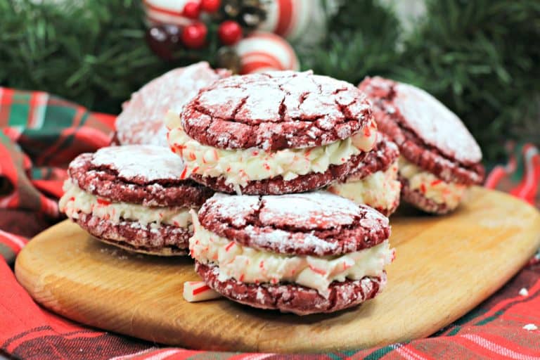 Peppermint Sandwich Cookies are so perfect for Christmas! It's a red velvet cookie filled with peppermint frosting!