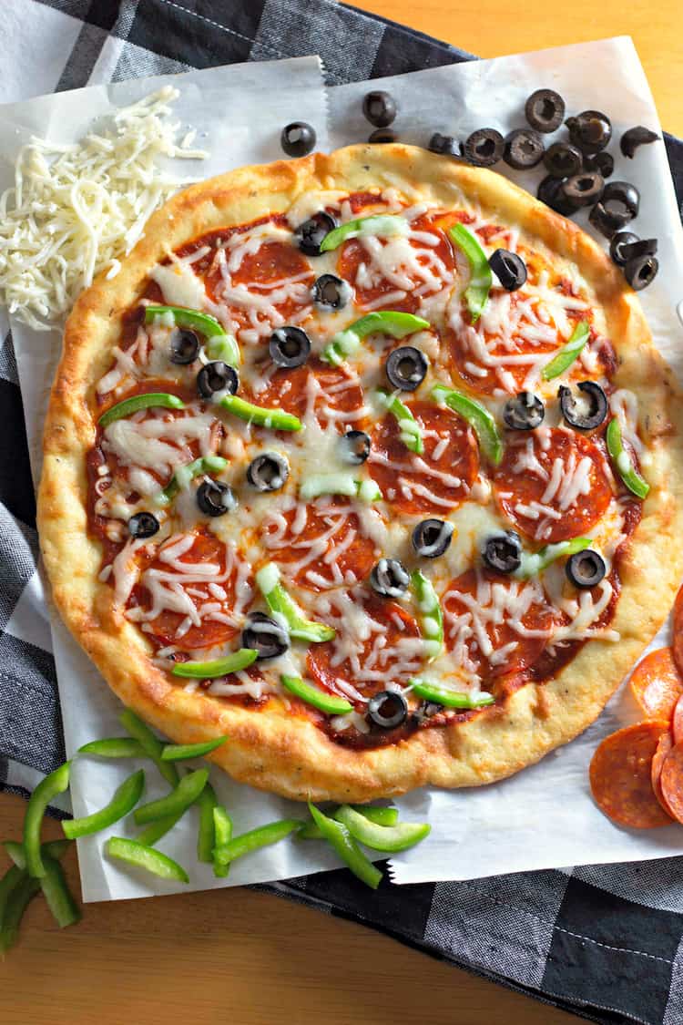 This recipe for Fathead Pizza Crust (Keto Recipe) is easy and delicious. It's also low carb and gluten free. Enjoy it for dinner or lunch!
