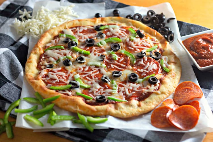 This Keto Pizza recipe is low carb and gluten free. It is so easy to make with just a few ingredients. It does not have cauliflower nor chicken crust. It is a Fathead dough. Add the toppings you want to make your favorite pizza. 
