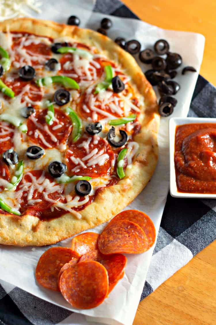 This Keto Pizza recipe is low carb and gluten free. It is so easy to make with just a few ingredients. It does not have cauliflower nor chicken crust. It is a Fathead dough. Add the toppings you want to make your favorite pizza. 
