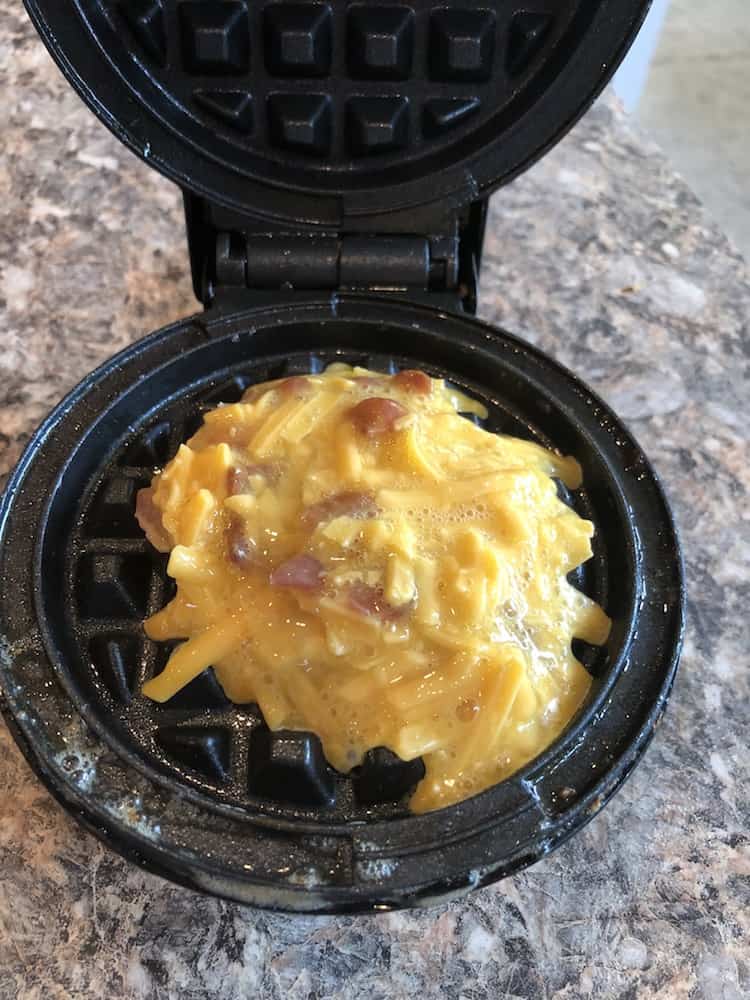 https://www.savingyoudinero.com/wp-content/uploads/2019/08/Keto-Bacon-Egg-Cheese-Chaffles-in-the-mini-waffle-maker.jpg