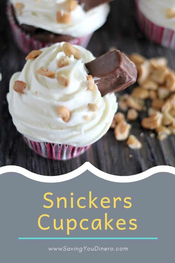 The best filled Snickers Cupcake recipe! Made with a sweetened condensed milk buttercream icing. The cake is homemade. It's a great way to use up Halloween candy or for a birthday cake. 