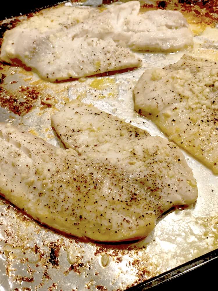 Try this dinner recipe for Quick & Easy Garlic Lemon Baked Tilapia! This healthy and flavorful meal comes together in about 15 minutes. Steam some broccoli for a filling and easy dinner. It's tender and flaky! I love recipes that bake in the oven so quickly! 