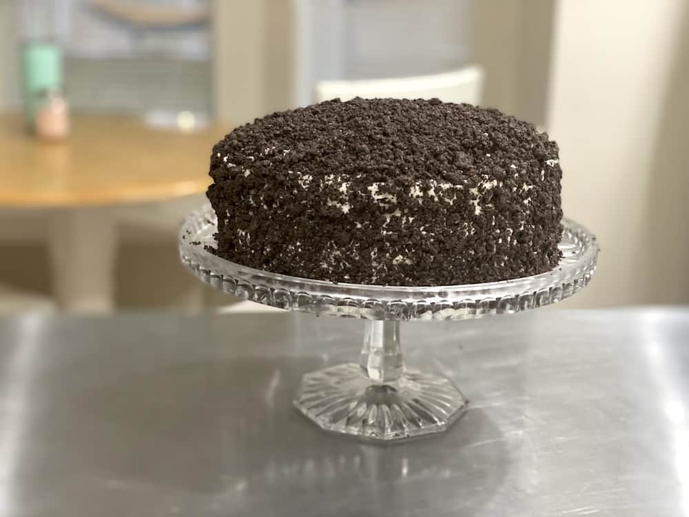 You will love this Chocolate Oreo Cake Recipe! It's a moist chocolate cake covered in vanilla buttercream and chocolate crumbles!