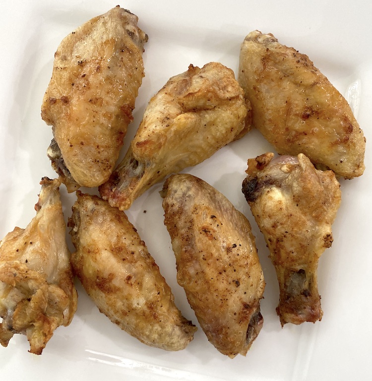 Add frozen wings to the air fryer basket for crispy chicken wings! Add your favorite dipping sauce or dry rub for the perfect meal or snack! It's such an easy appetizer or meal that is made in less than 30 minutes. 