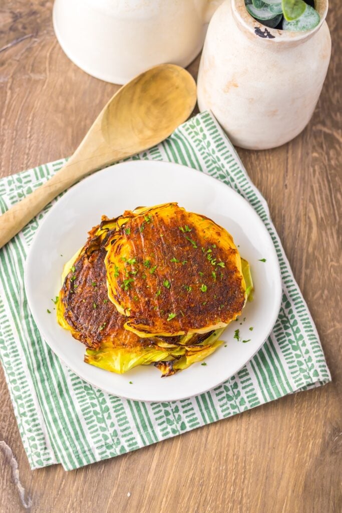 Crispy roasted cabbage steaks topped with Parmesan! This easy low carb, keto-friendly veggie recipe makes the perfect cheesy side dish for any meal