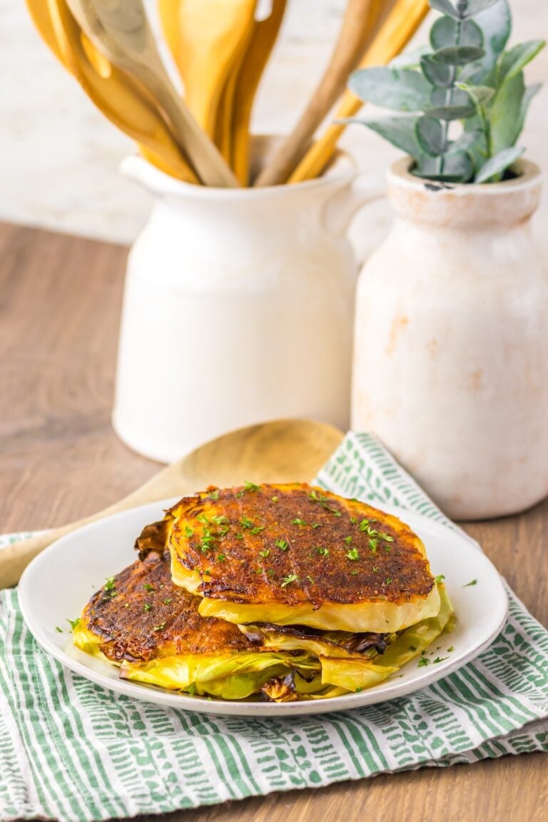 Crispy roasted cabbage steaks topped with Parmesan! This easy low carb, keto-friendly veggie recipe makes the perfect cheesy side dish for any meal