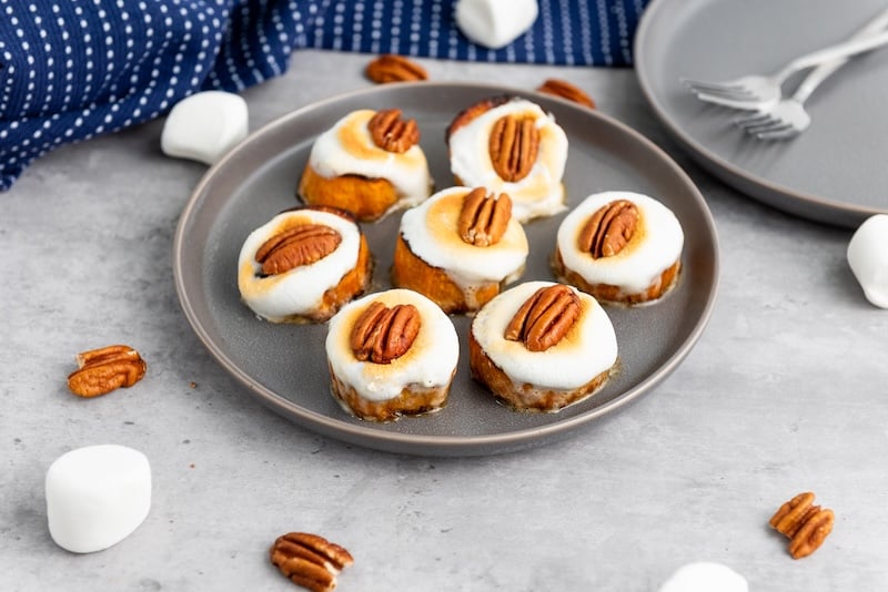 Easy sweet potato bites made with toasted marshmallows and pecans. The perfect holiday appetizer will be your favorite sweet potato recipes.