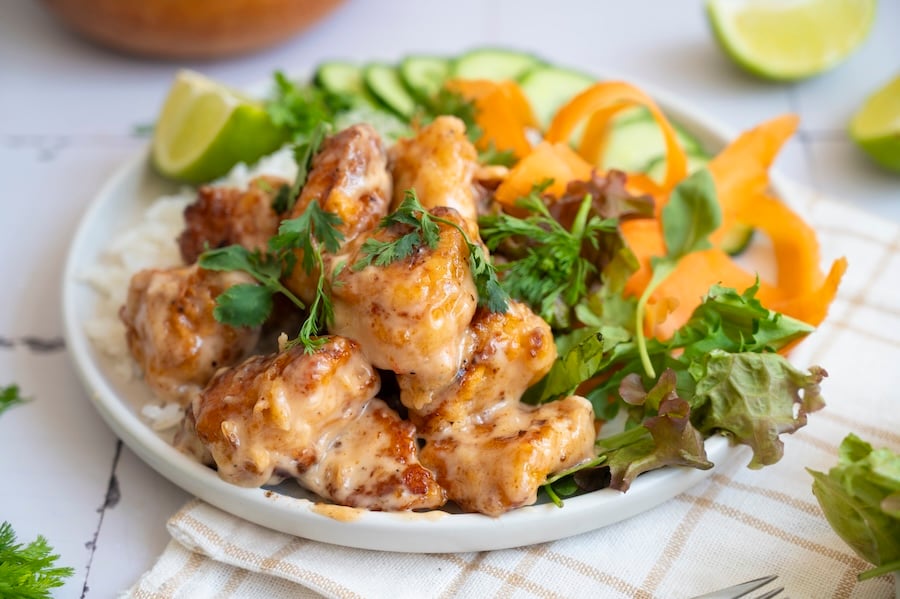 Try this Bang Bang Chicken recipe! A crispy Bang Bang Chicken bowl with a creamy Bang Bang Chicken sauce and fresh rice.
