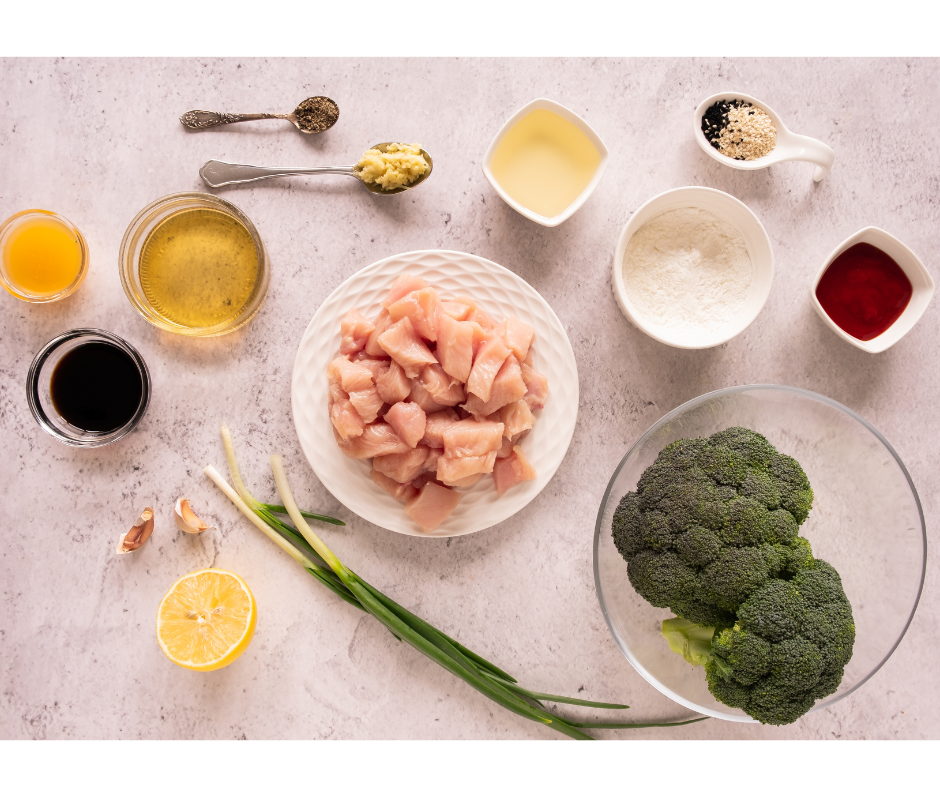 Ingredients for honey garlic chicken including raw chicken, broccoli, soy sauce, and honey.