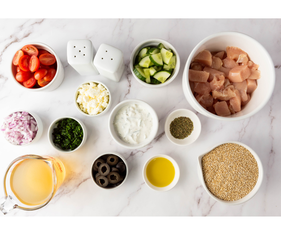 Raw ingredients for an easy quinoa bowl recipe including quinoa, chicken, olive oil, and fresh vegetables.