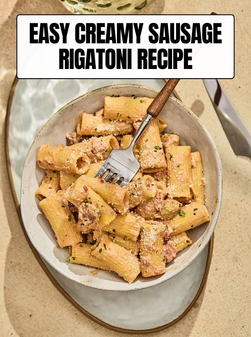 A bowl of creamy Sausage Rigatoni topped with grated parmesan cheese with a text overlay reading "EASY CREAMY SAUSAGE RIGATONI RECIPE.
