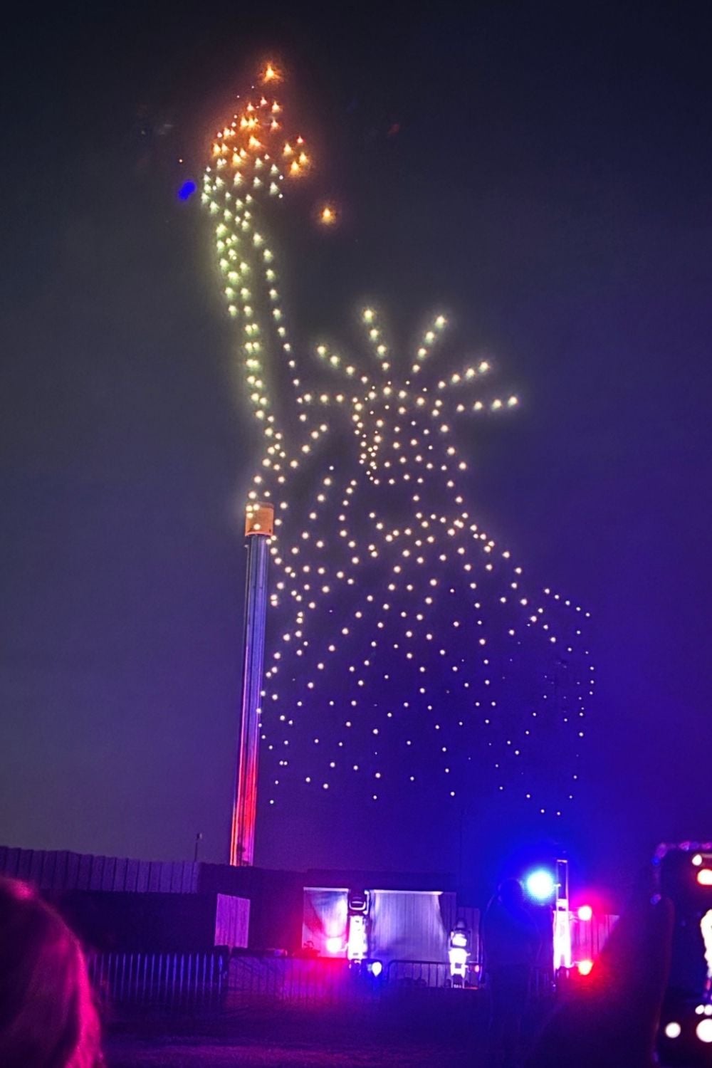 Drones forming the shape of the Statue of Liberty in the night sky during the Summer Nights celebration at Busch Gardens.