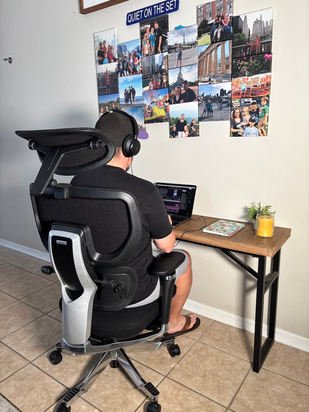 Black ergonomic desk chair with lumbar support and footrest in a home study space, highlighting the benefits of a supportive chair for students.