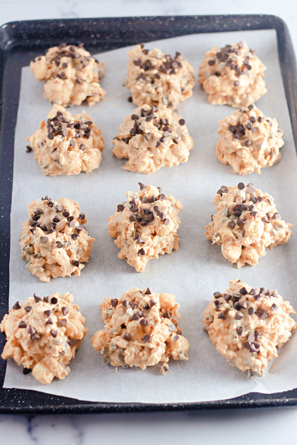 Close-up of homemade no bake Avalanche Cookies with Rice Krispies, peanut butter, and chocolate chips.